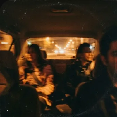 Friends in a car at night